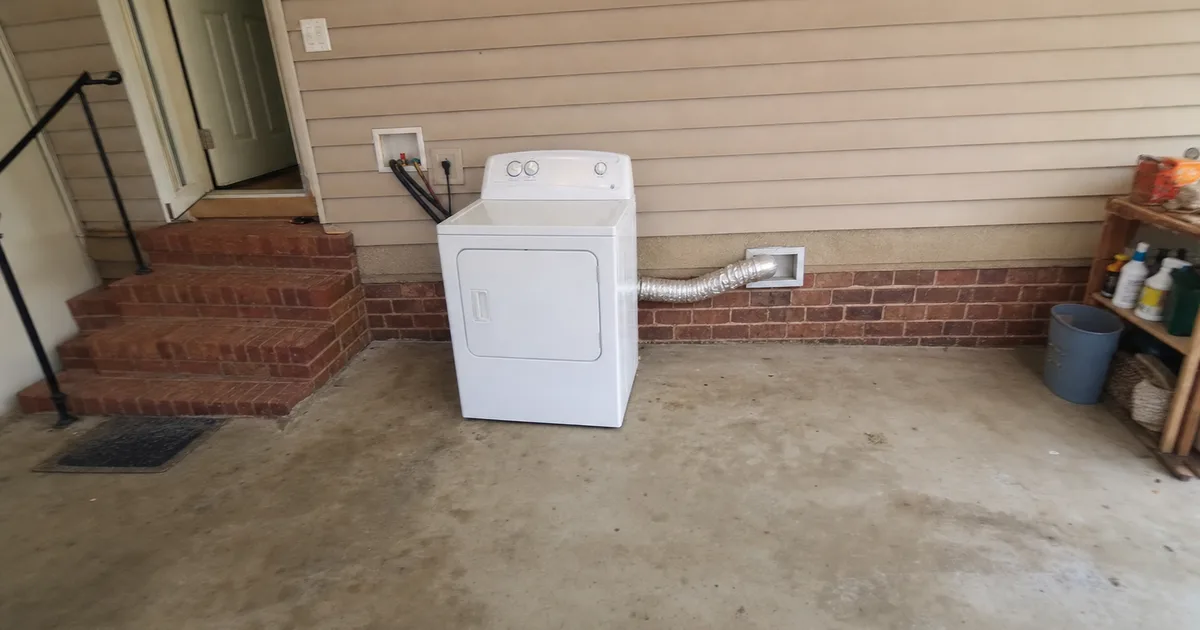 A Home Dryer Pulled Out From The Wall in Houston, TX